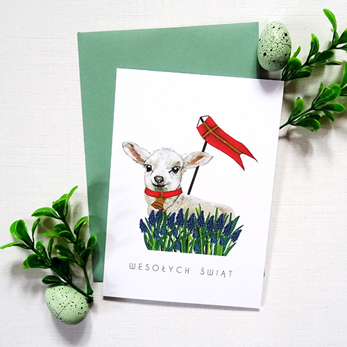 Ilustrowana Kartka Wielkanocna z tradycyjnym Barankiem wraz z ręcznie zdobionymi delikatnymi detalami oraz napisem Wesołych Świąt.