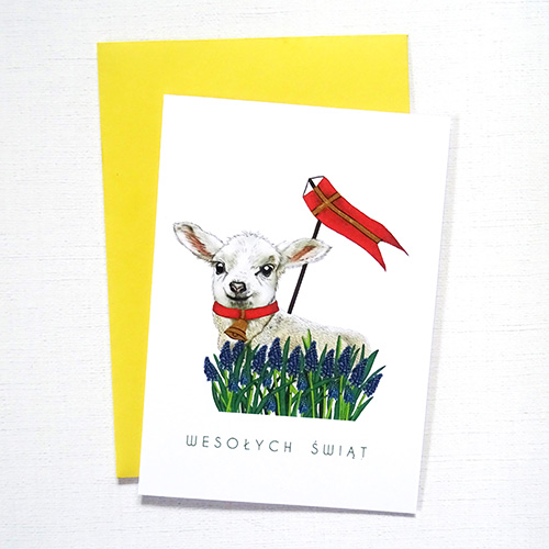 Ilustrowana Kartka Wielkanocna z tradycyjnym Barankiem wraz z ręcznie zdobionymi delikatnymi detalami oraz napisem Wesołych Świąt.